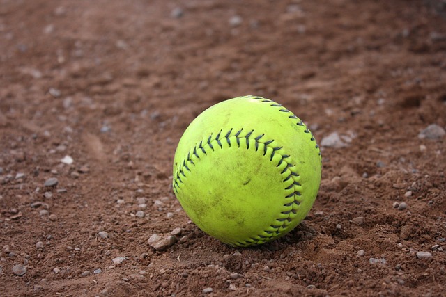 Close-up of a softball on the field.