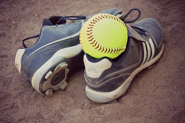 A pair of softball cleats.